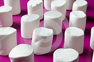 White marshmellow on pink background