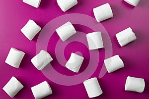 White marshmellow on pink background