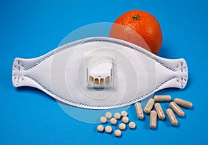 White mask with glasses and vitamines against virus, corona or flu photo