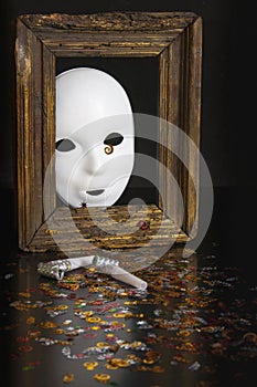 White mask in an old frame