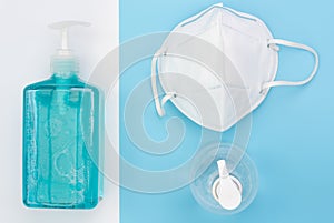 White mask for wearing germ protection  and gel alcohol or hand sanitizer spray bottle for washing hand  to protect from corona