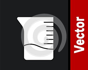 White Measuring cup icon isolated on black background. Plastic graduated beaker with handle. Vector Illustration