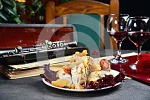 White meat of turkey chicken with dried fruits. Rustic style. Close-up.