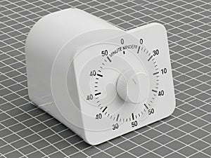 White mechanical timer on grid background
