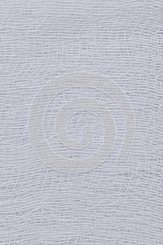 White medical bandage gauze texture, abstract vertical textured background macro closeup natural cotton linen fabric copy space