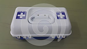 White medical box or first aid kit with plus or cross sign