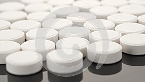 White medical pills rotating closeup