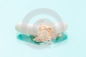 White medicine capsules probiotic powder inside. Close up. High resolution product. Health care concept - Image