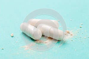 White medicine capsules probiotic powder inside. Close up. High resolution product. Health care concept - Image