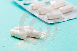 White medicine capsules probiotic powder inside. Close up. High resolution product. Health care concept - Image