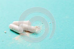 White medicine capsules probiotic powder inside. Close up. High resolution product. Health care concept - Image