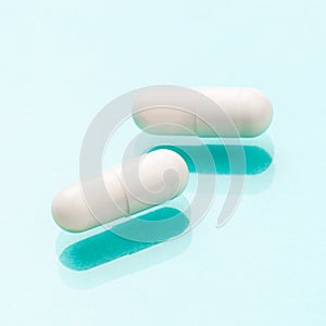 White medicine capsules probiotic powder inside. Close up. High resolution product. Health care concept - Image