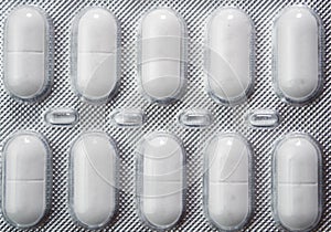 White medicine pills in blister pack. The concept of medicine or drug abuse
