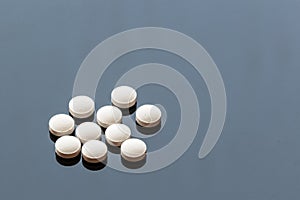 White Medicine Pills isolated on Glass Background