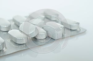 White medicine tablets antibiotic pills.