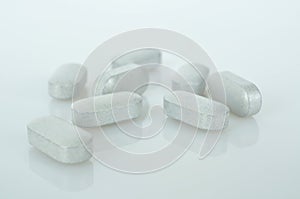 White medicine tablets antibiotic pills.