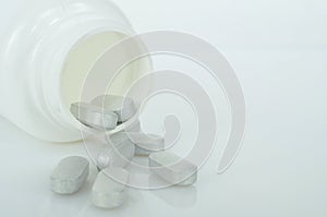 White medicine tablets antibiotic pills.