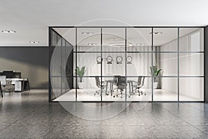 White meeting room in gray open space office