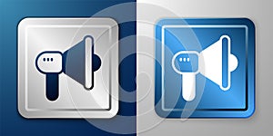White Megaphone icon isolated on blue and grey background. Speaker sign. Silver and blue square button. Vector