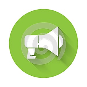 White Megaphone icon isolated with long shadow. Speaker sign. Green circle button. Vector