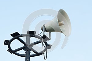 White megaphone on the old pole