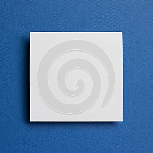 White memo pad, empty paper on dark blue background