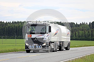 White Mercedes-Benz Actros Fuel Tank Truck on Summer Road