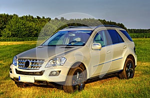 White Mercedes ML, new SUV, sideview