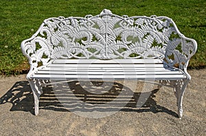 White metal bench in a garden