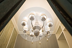 white metal chandelier decorating in the room