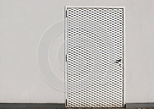 White metal door for exterior, with embossed small rhomboid shapes on all its surface