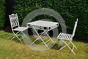White metal garden furniture table and two chairs