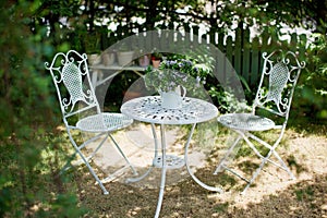 White metal garden table and chairs