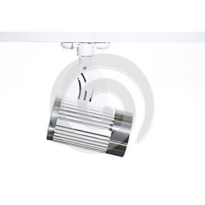 White with metal LED spotlight on white background. side view