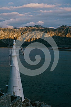 A white metal lighthouse in the Verige Strait, in the Bay of Kotor in Montenegro. photo