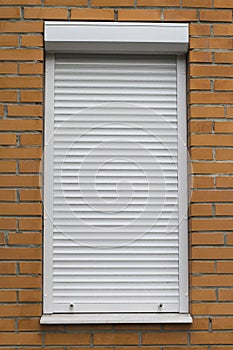 White metal protective roller shutters in white color