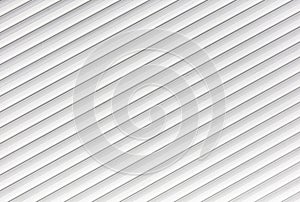 White metal roller shutter door texture background. Texture of white metal roller shutter door