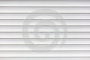 White metal roller shutter door texture background. Texture of white metal roller shutter door