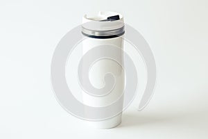 White metal travel mug with a place for your design on white background. Isolated. Mockup. Close up