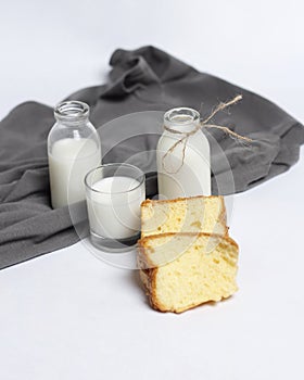 White milk drink served with bread is good for breakfast in the morning.