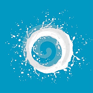 White milk splash and drops isolated on blue background