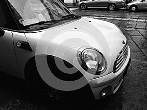 white Mini car in Turin in black and white