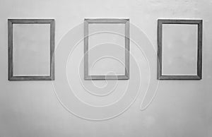 White minimalist mock up. 3 three frame poster gallery with white walls. Concept of the art of advertising. Picture frames in a