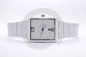 White minimalistic wristwatch  on white backgrounds