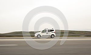 White minivan on highway