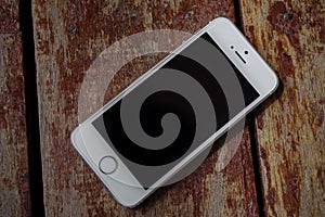 White Mobile phoneiPhone on Brown Wood