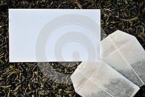 White mockup and tea bags on a loose leaf tea background