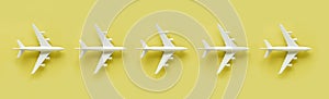 White model plane, airplane on yellow background. Banner.