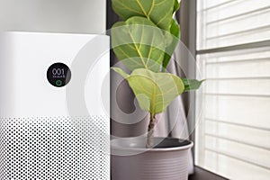 White modern air purifier in a living room for refresh air flow at home,Advanced air purifying and protect Pm2.5