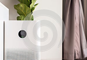 White modern air purifier in a living room for refresh air flow at home,Advanced air purifying and protect Pm2.5